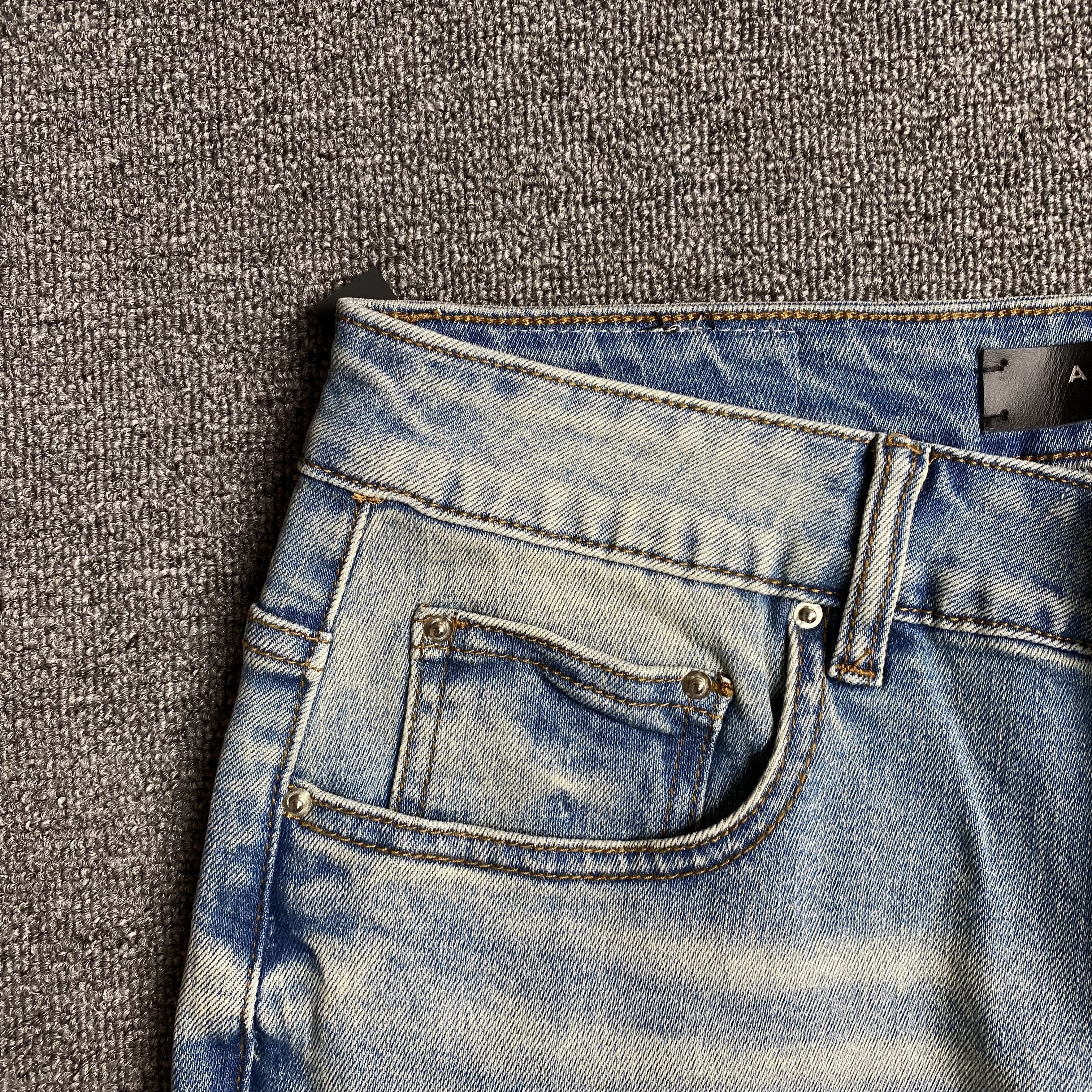 AMIRI VARSITY LOGO JEANS