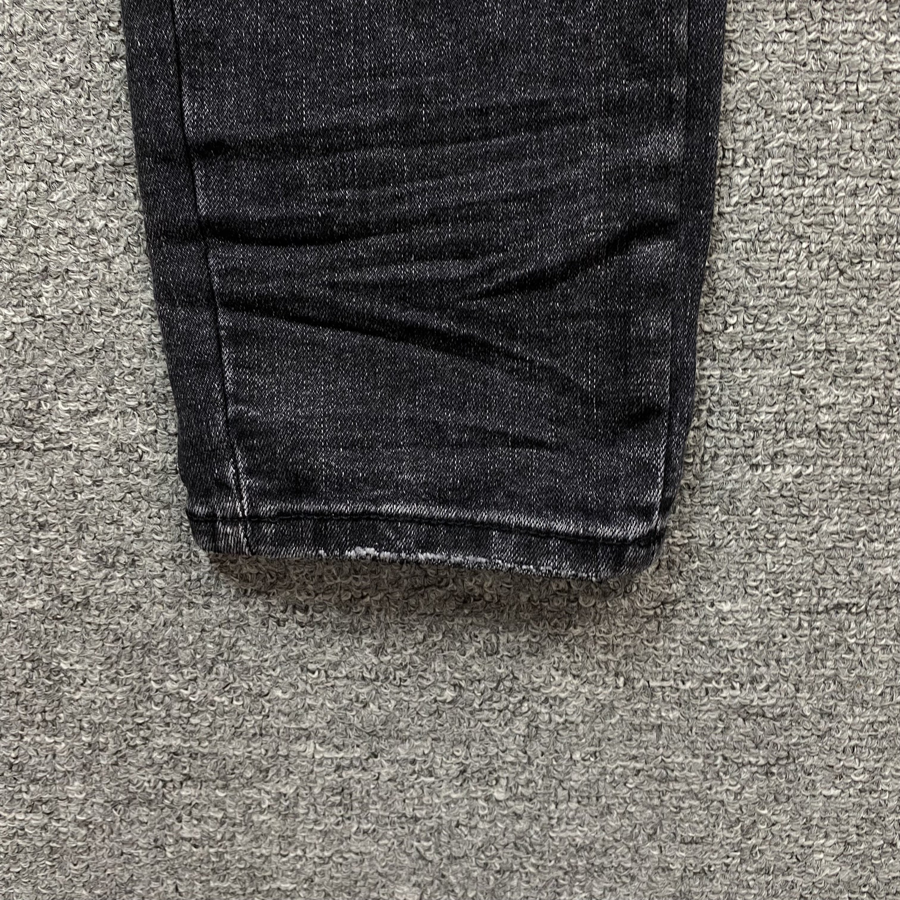AMIRI VARSITY LOGO REPAIR JEANS